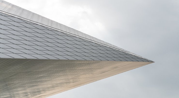 Graphic showing a fragment of the Swiss Tech Convention Center shaped like an arrowhead