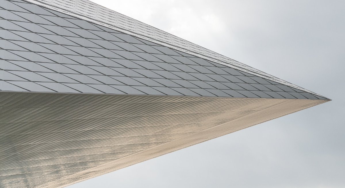 Graphic showing a fragment of the Swiss Tech Convention Center shaped like an arrowhead